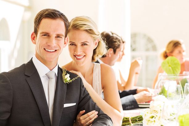 bride-and-groom-smiling-at-reception