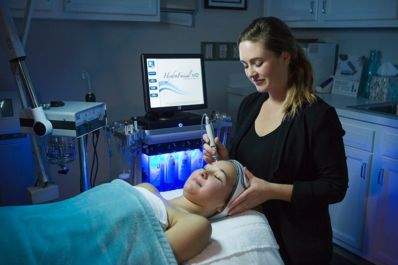 Patient getting a HydraFacial MD treatment at Exhale Med Spa in Little Rock