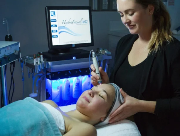 Woman getting a hydrafacial and other cosmetic services at our medical spa