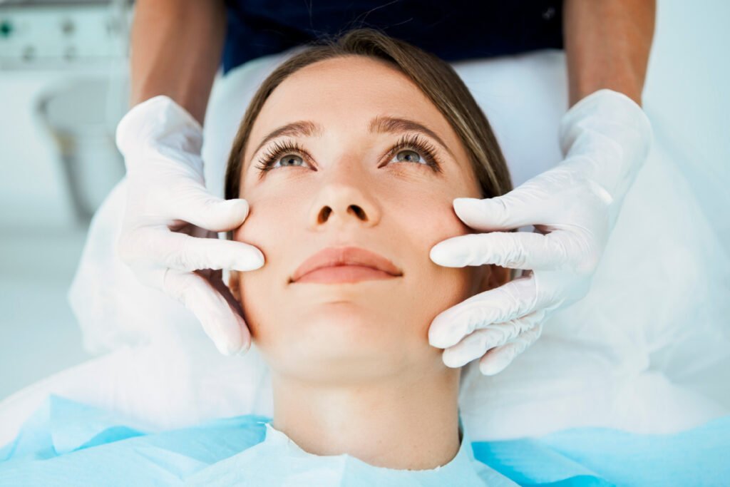 Young woman gets a VI Peel treatment from an aesthetician at a Little Rock med spa