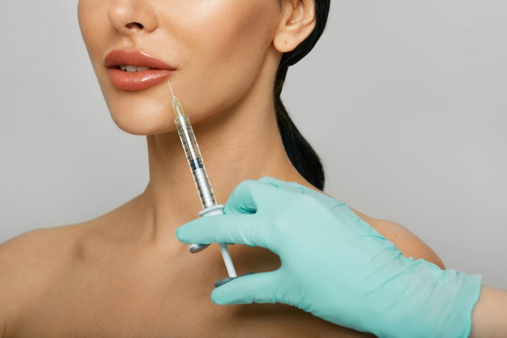 Woman with injectable lip treatment at a med spa