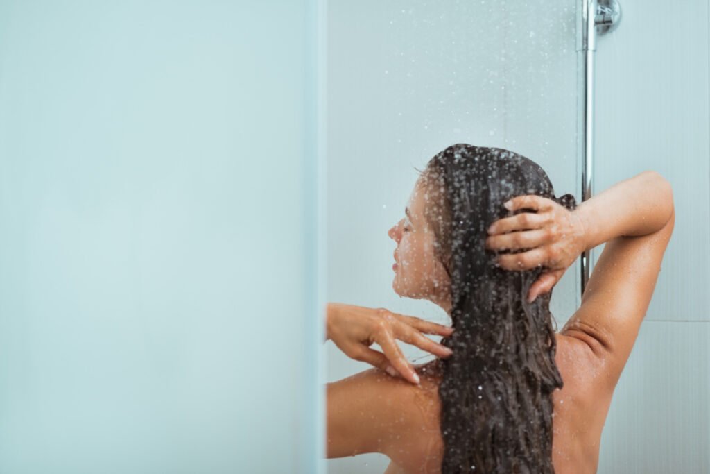 Woman talking a cold shower