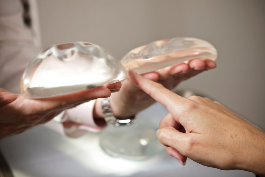 Woman comparing breast implants during a consultation