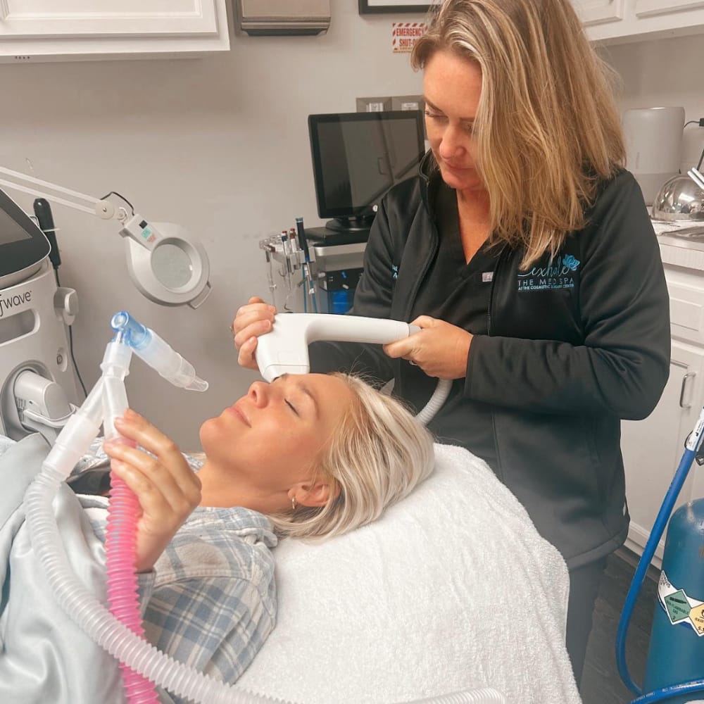 Our aesthetician performing Sofwave skin tightening on a patient at Exhale Med Spa